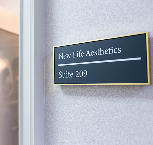 New Life Aesthetics Suite Sign